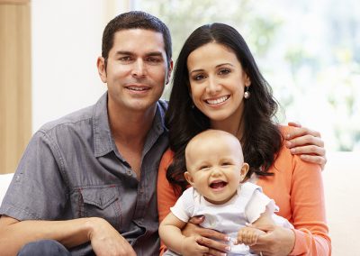 couple-with-baby-smiling